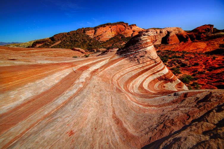 Layered rock formations in Overton, Nevada with vivid colors and textures.