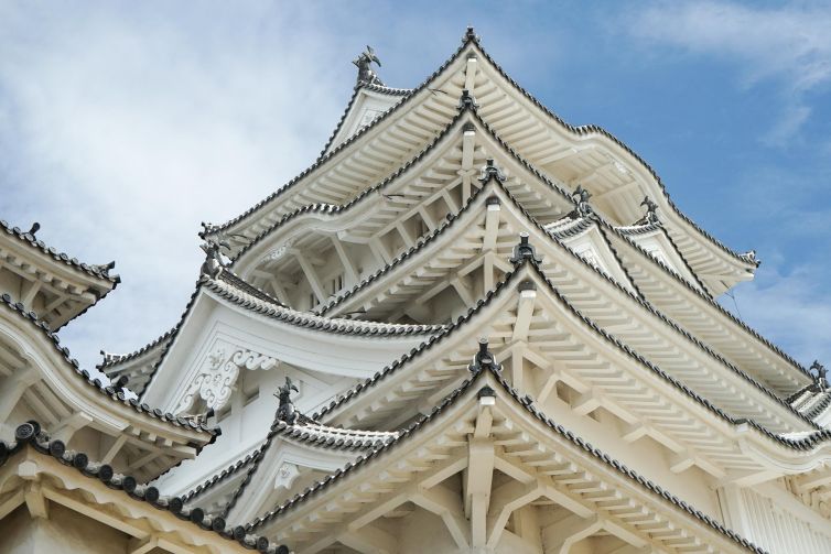 Ornate rooftops of Himeji Castle in Japan, showcasing traditional architectural elegance.