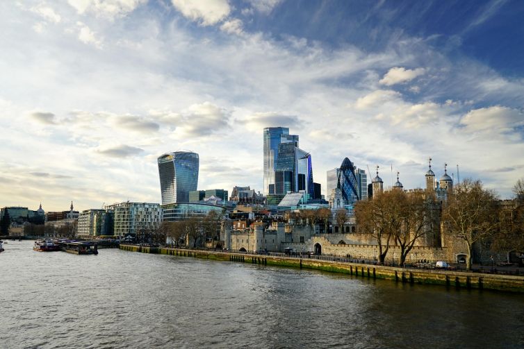 London skyline featuring historic and contemporary buildings along the River Thames.