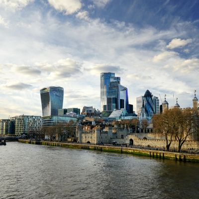 London skyline featuring historic and contemporary buildings along the River Thames.